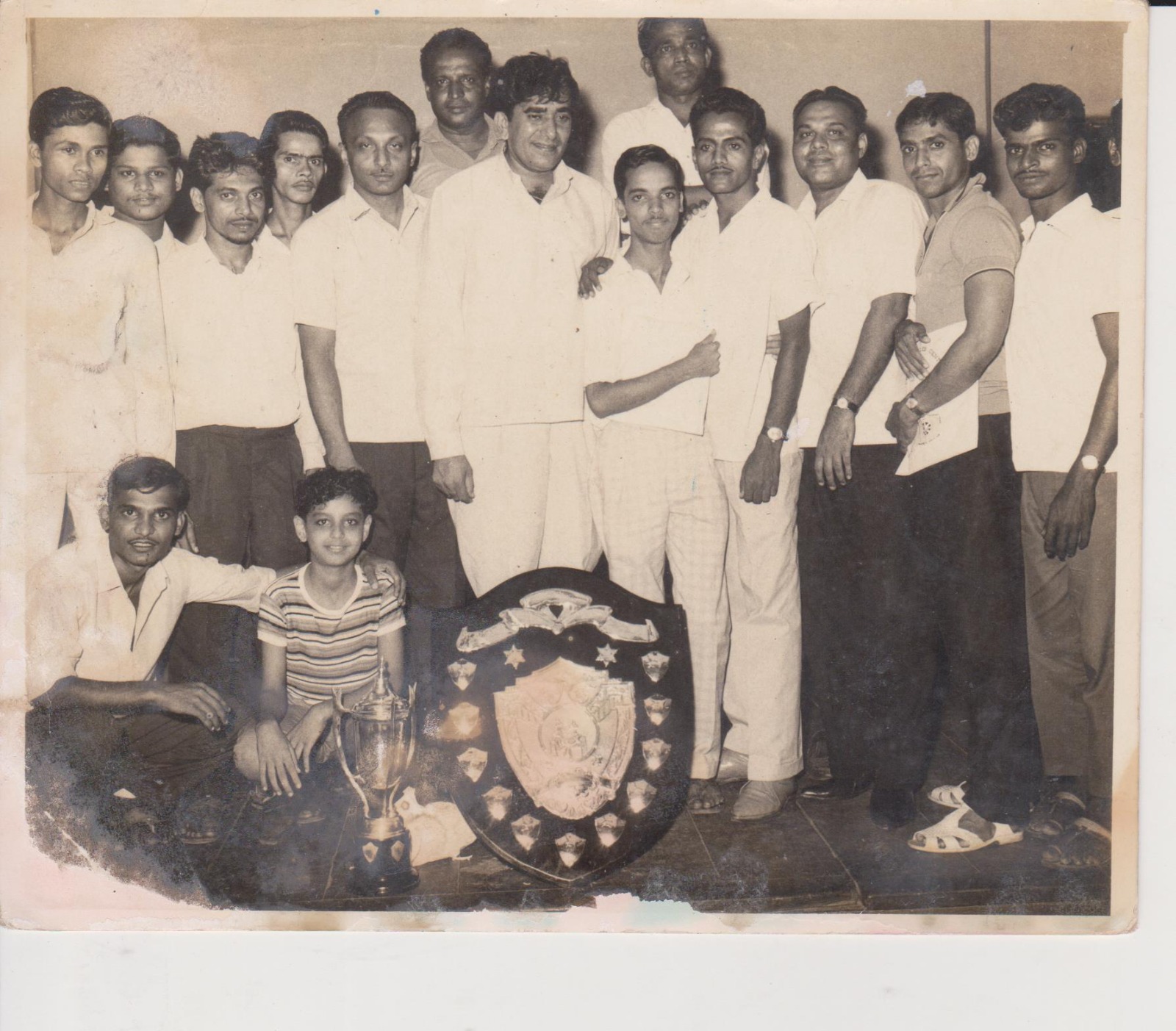 Team victory with heritage shield and trophy — early carrom years